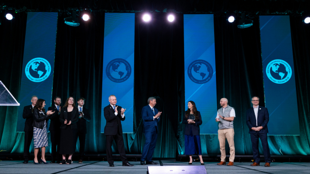 People on stage for awards.