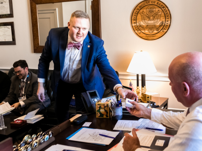 Two men meeting in a congressional office.